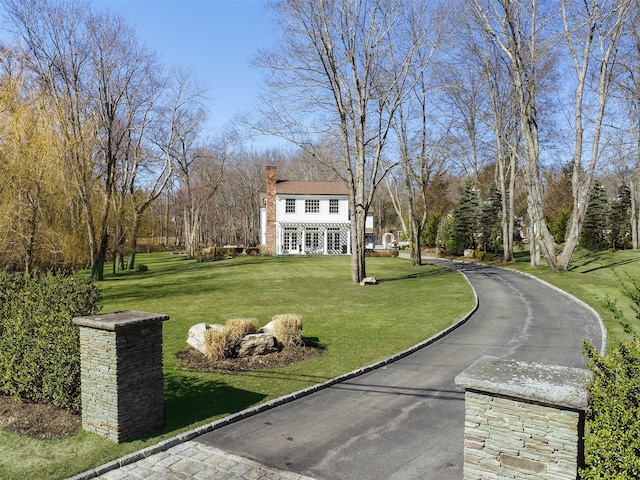 view of community featuring a yard