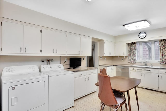 laundry room with laundry area, a sink, and washing machine and clothes dryer