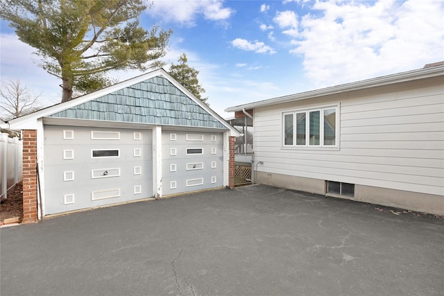 exterior space with visible vents and fence