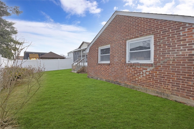 view of yard with entry steps and fence