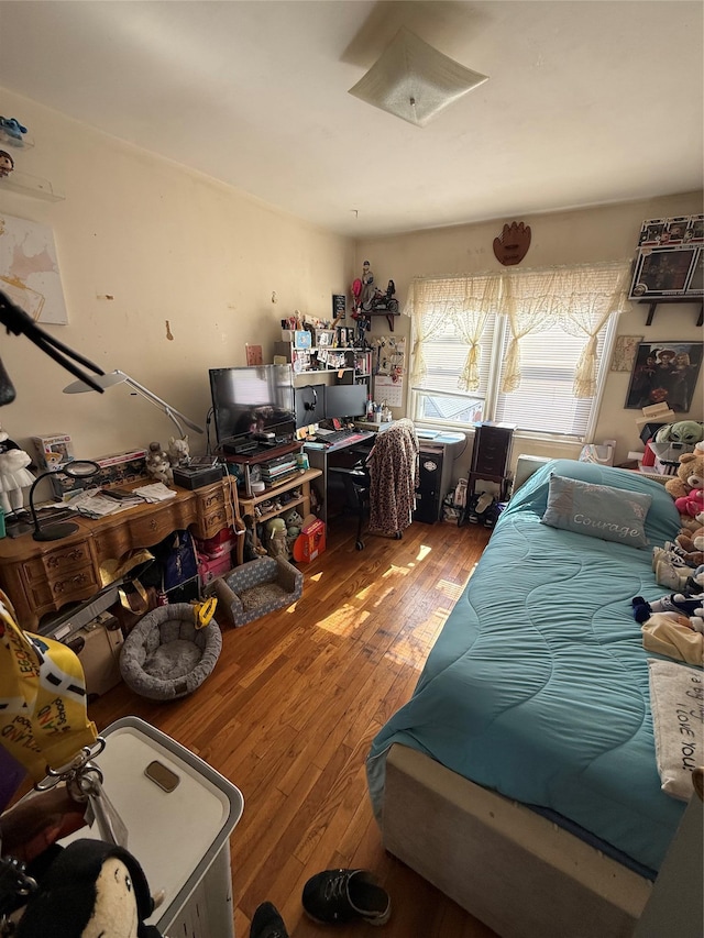 bedroom with wood-type flooring