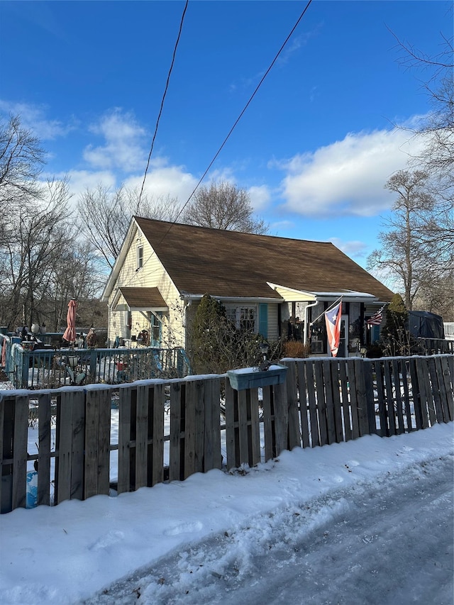 snow covered patio with fence private yard