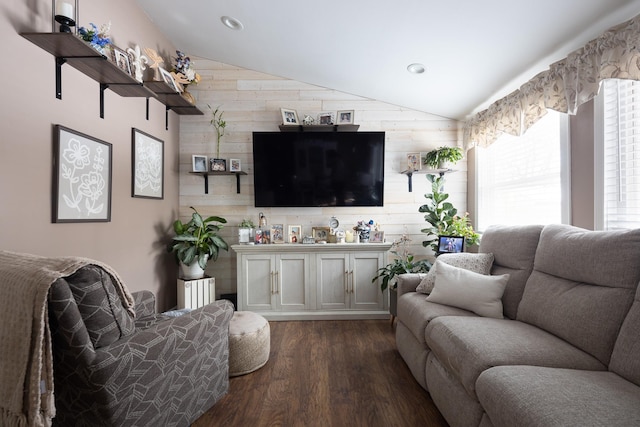 living room featuring lofted ceiling, dark wood finished floors, and recessed lighting