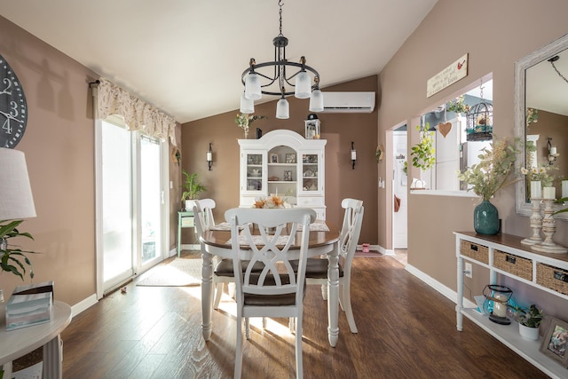 dining room featuring baseboards, a wall unit AC, wood finished floors, vaulted ceiling, and a notable chandelier