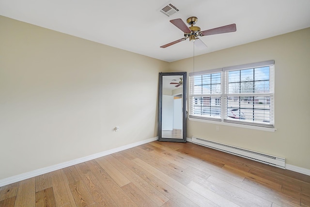 unfurnished room with baseboards, visible vents, ceiling fan, baseboard heating, and light wood-style floors