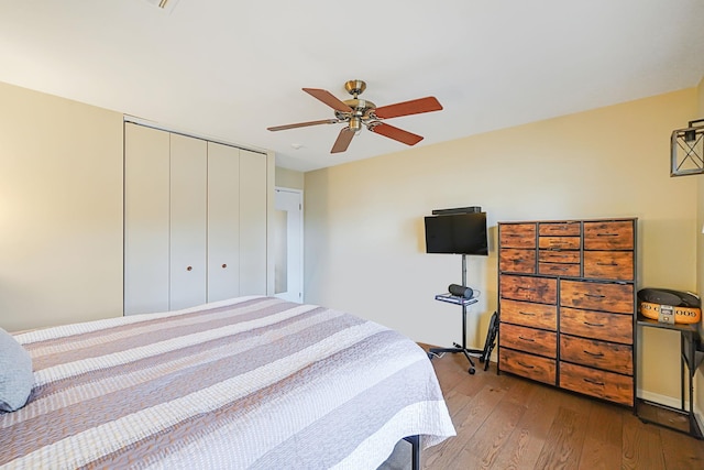 bedroom with a closet, ceiling fan, and hardwood / wood-style floors