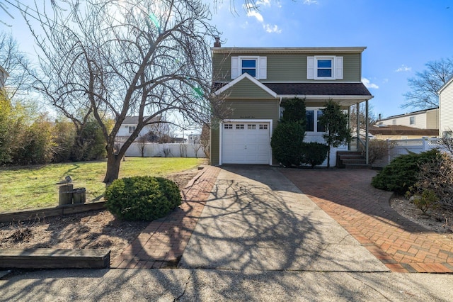 view of front of property with a garage, concrete driveway, a chimney, fence, and a front yard