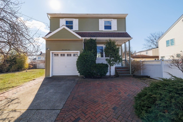 view of front of home with a garage, covered porch, fence, roof with shingles, and decorative driveway