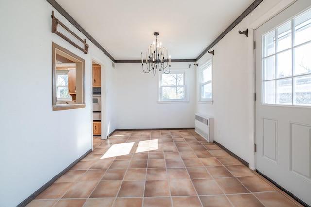 unfurnished dining area featuring light tile patterned floors, radiator heating unit, a chandelier, and ornamental molding