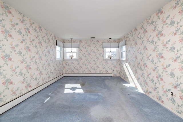 empty room with carpet floors, a healthy amount of sunlight, baseboard heating, and wallpapered walls