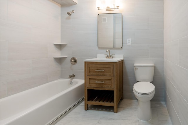 full bath featuring bathing tub / shower combination, tile walls, toilet, and vanity