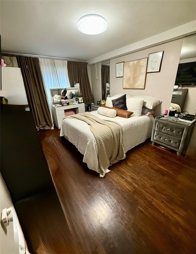 bedroom featuring wood finished floors