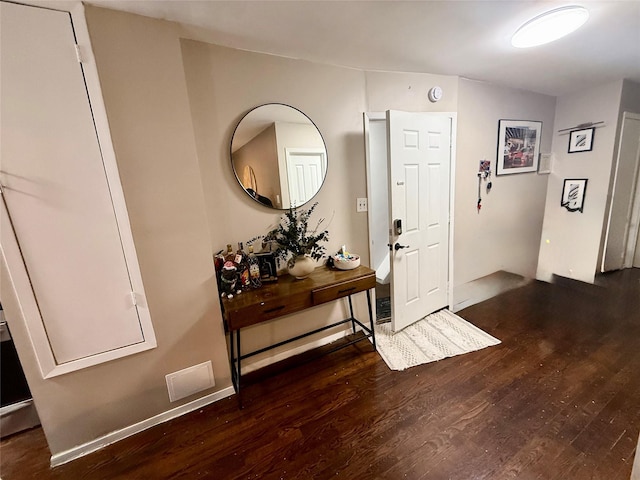 foyer entrance with wood finished floors