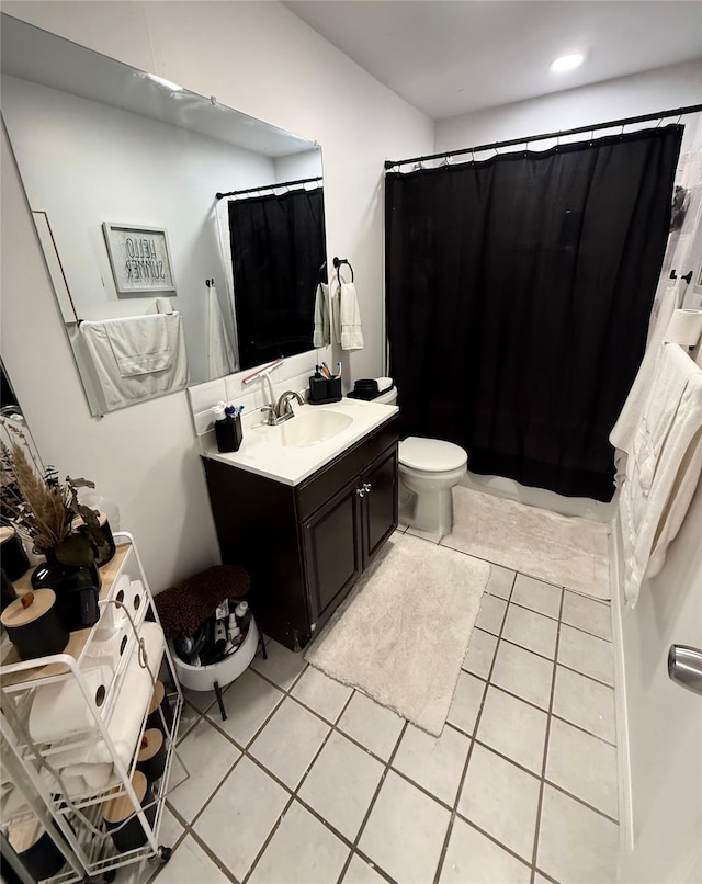 full bathroom featuring toilet, tile patterned floors, curtained shower, vanity, and recessed lighting