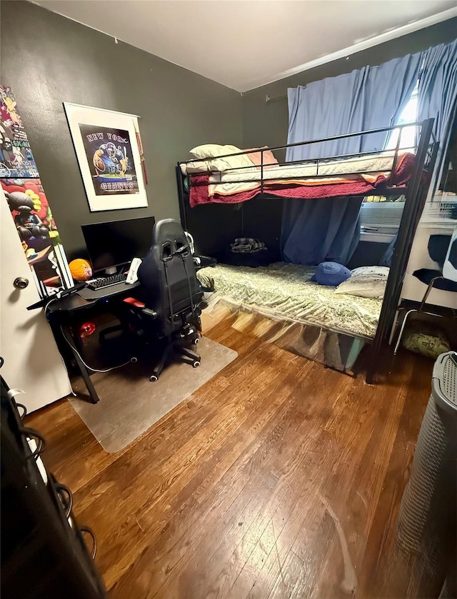 bedroom featuring wood finished floors