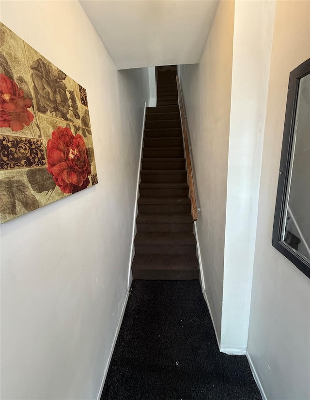 staircase with baseboards