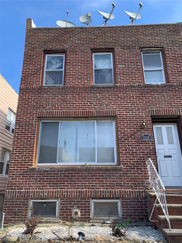 view of front of home with brick siding