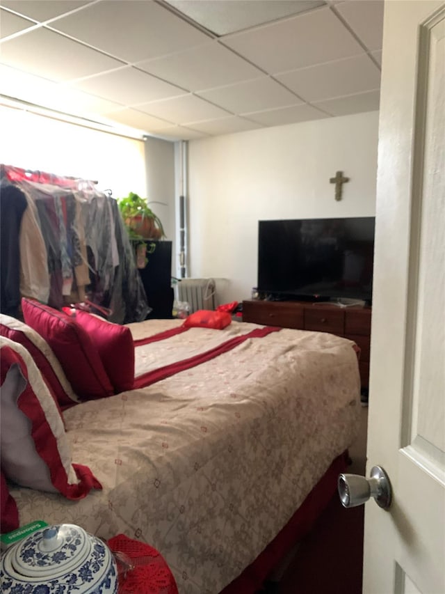 bedroom with a paneled ceiling