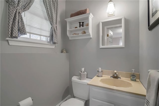 bathroom featuring vanity and toilet