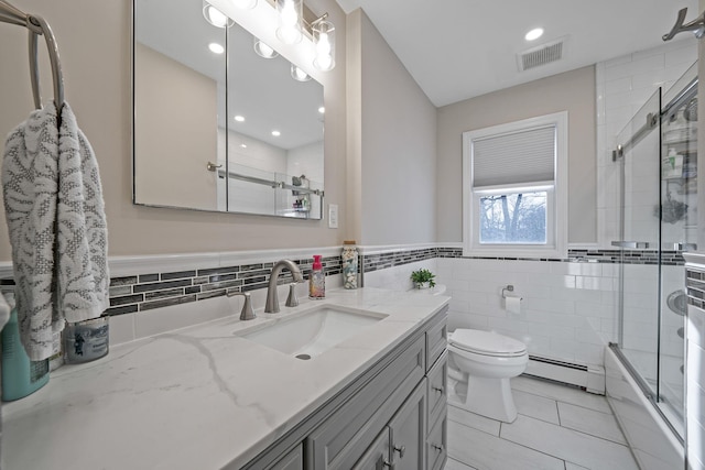 bathroom featuring a baseboard radiator, tile patterned flooring, toilet, vanity, and visible vents