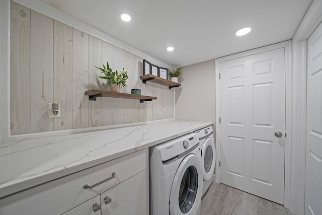 washroom with laundry area, light wood-style flooring, washer and clothes dryer, and recessed lighting