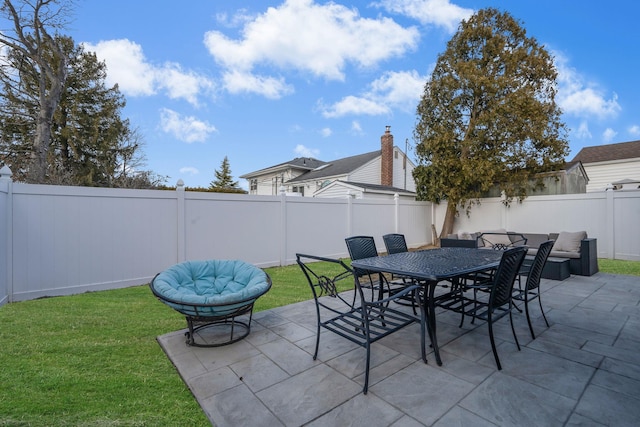 view of patio with outdoor dining space and a fenced backyard