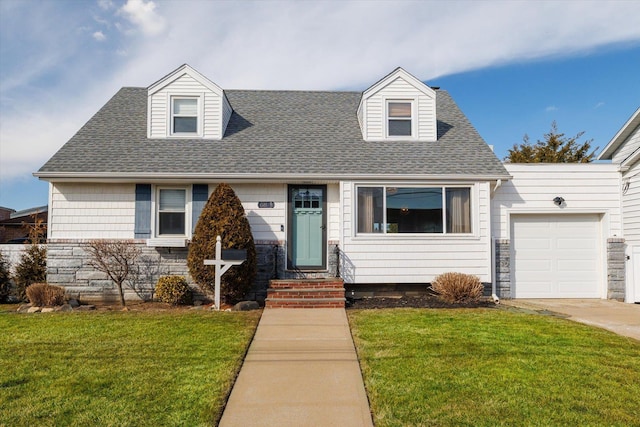 cape cod house with roof with shingles, concrete driveway, an attached garage, stone siding, and a front lawn