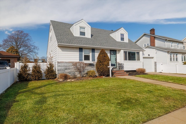 cape cod home with a garage, fence, stone siding, roof with shingles, and a front yard