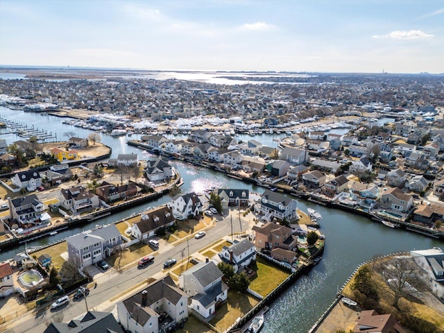 birds eye view of property featuring a water view and a residential view