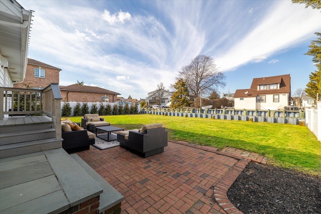 view of patio featuring outdoor lounge area, a fenced backyard, and a residential view