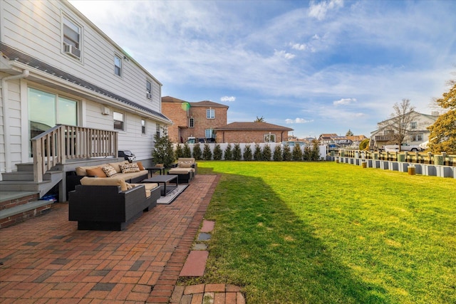 view of yard featuring a patio area, a residential view, and an outdoor living space