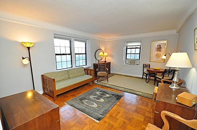 living room with cooling unit and baseboards