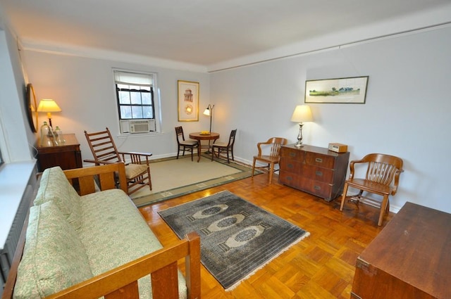 living room with cooling unit and baseboards