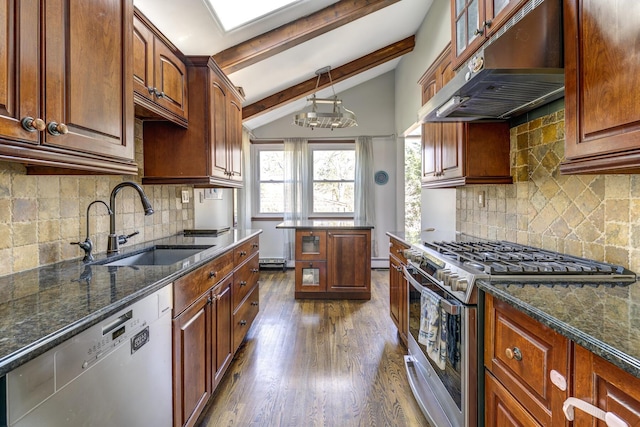 kitchen featuring dark wood-style flooring, vaulted ceiling with beams, appliances with stainless steel finishes, a sink, and under cabinet range hood