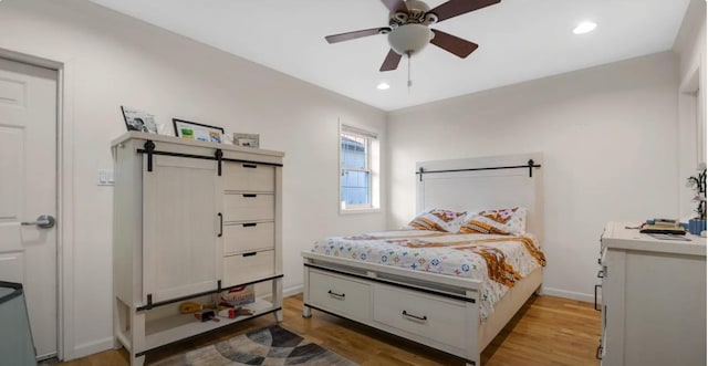 bedroom featuring ceiling fan, recessed lighting, baseboards, and light wood-style floors