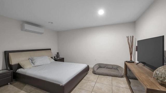 bedroom featuring recessed lighting, a wall unit AC, baseboards, and light tile patterned floors