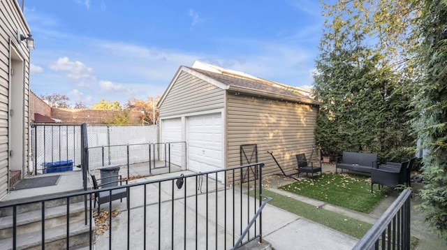 exterior space featuring an outbuilding and fence