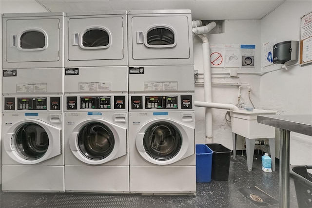 community laundry room with stacked washer and dryer and independent washer and dryer