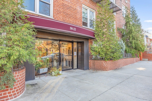 property entrance with brick siding