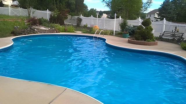 view of swimming pool featuring a fenced in pool and a fenced backyard