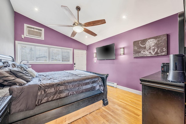 bedroom featuring baseboards, lofted ceiling, a wall unit AC, wood finished floors, and baseboard heating