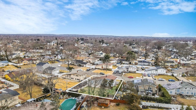 birds eye view of property with a residential view