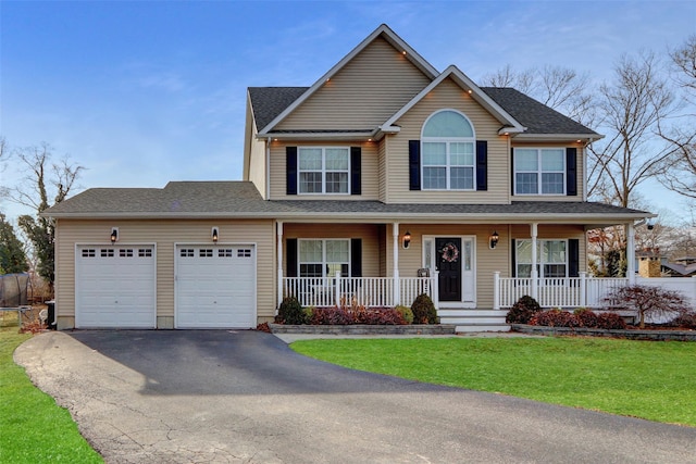 view of front facade featuring aphalt driveway, an attached garage, covered porch, roof with shingles, and a front lawn