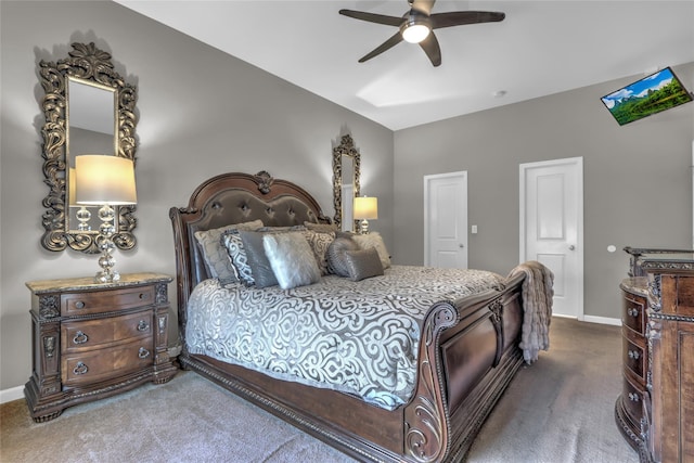 carpeted bedroom with ceiling fan and baseboards