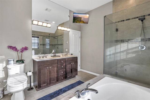 full bathroom with double vanity, a stall shower, visible vents, tile patterned flooring, and a sink