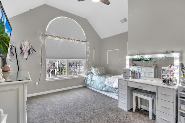 carpeted bedroom featuring a ceiling fan, visible vents, vaulted ceiling, and baseboards