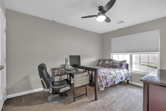 carpeted bedroom with baseboards, visible vents, and a ceiling fan