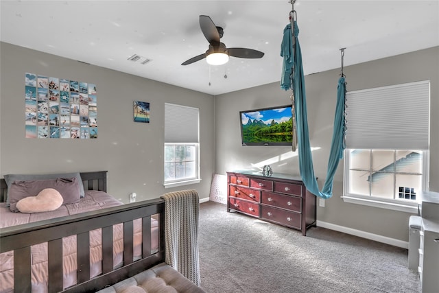 bedroom with carpet, visible vents, ceiling fan, and baseboards