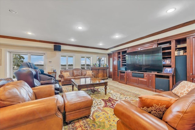 living area with ornamental molding and recessed lighting