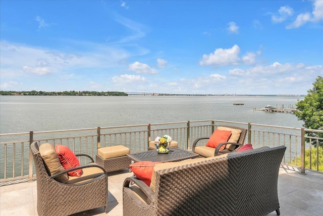 view of patio featuring a water view and outdoor lounge area